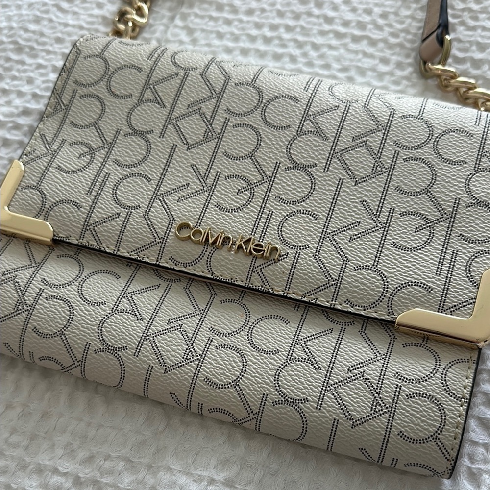 Calvin Klein Cream and Gold Crossbody Bag with Flap Closure
